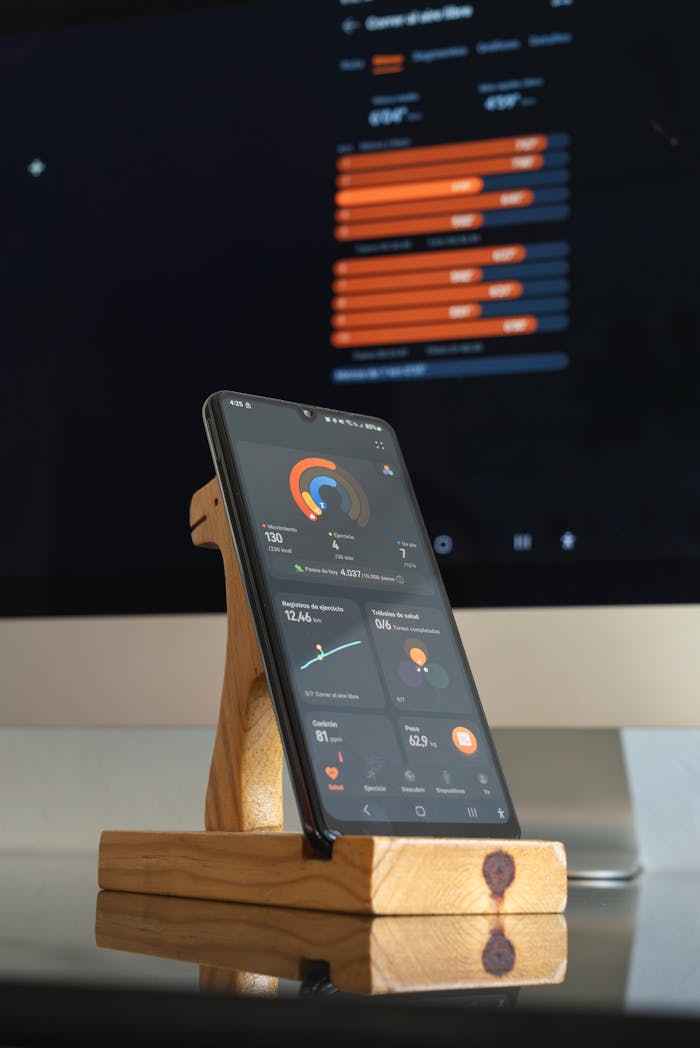 Smartphone showcasing a fitness app with analytics charts, perfect for a healthy lifestyle concept.