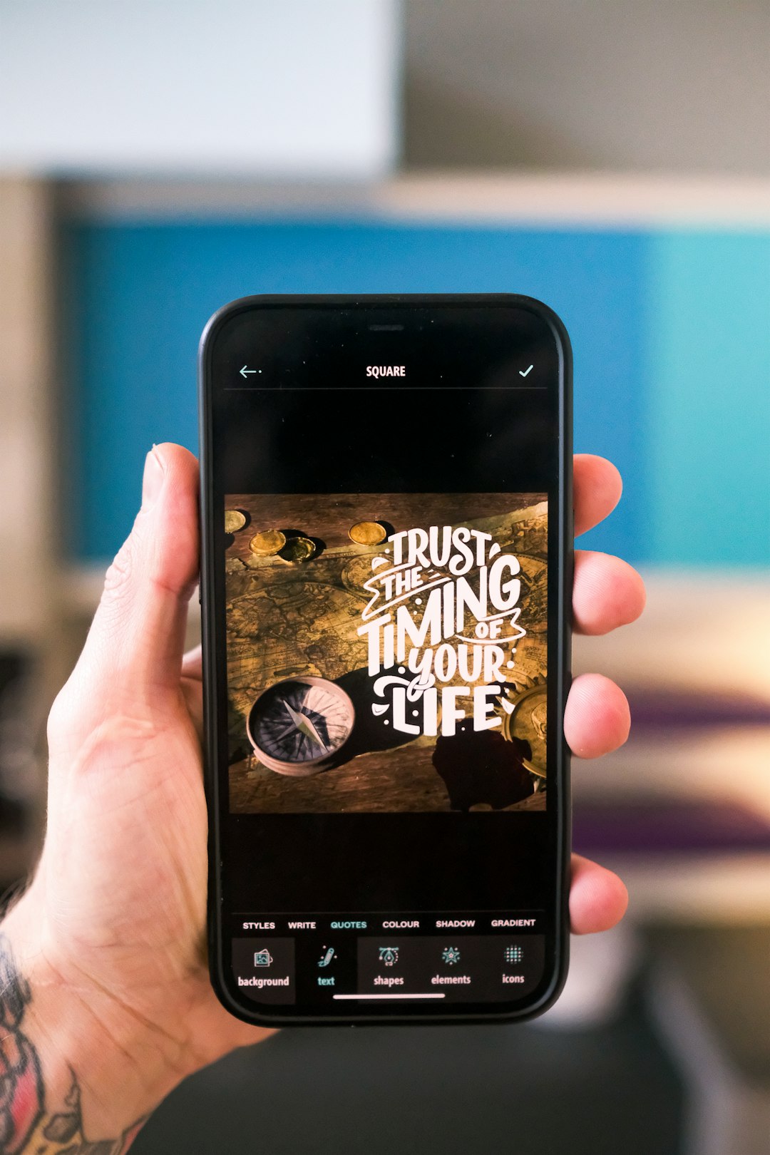 Mans hand holding Apple iPhone using the Typerium App with man creating motivational trust the timing of your life instagram post.

Download Free 👉 www.typerium.com