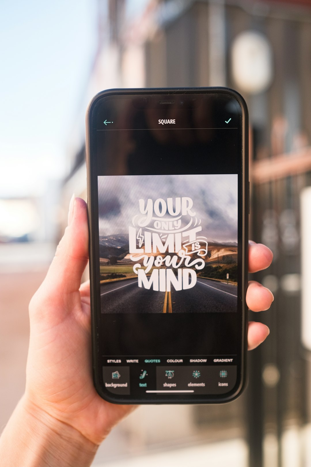 Womans hand holding Apple iPhone using the Typerium App to create motivational Your only limit is your mind quote.

Download Free 👉 www.typerium.com